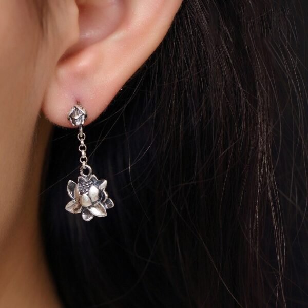 Sterling Silver lotus Drop Earrings on ear