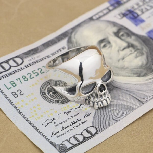 Huge Solid Silver Skull Ring on a bank note