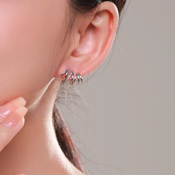 Silver Wave Stud Earrings on ear
